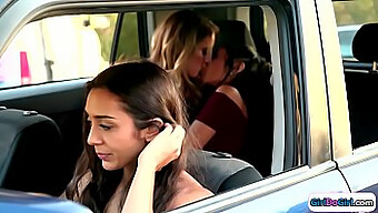 Lilly Hall And Candice Dare Engage In Passionate Kissing In The Rear Seat Of A Vehicle, Observed By An Unidentified Driver